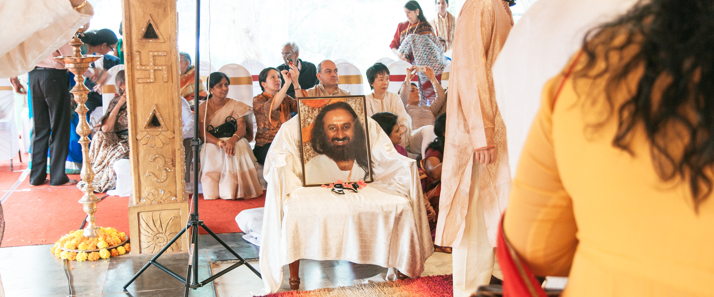 The Portrait of Sri Sri Ravi Shankar Watching Over the Wedding Ceremony