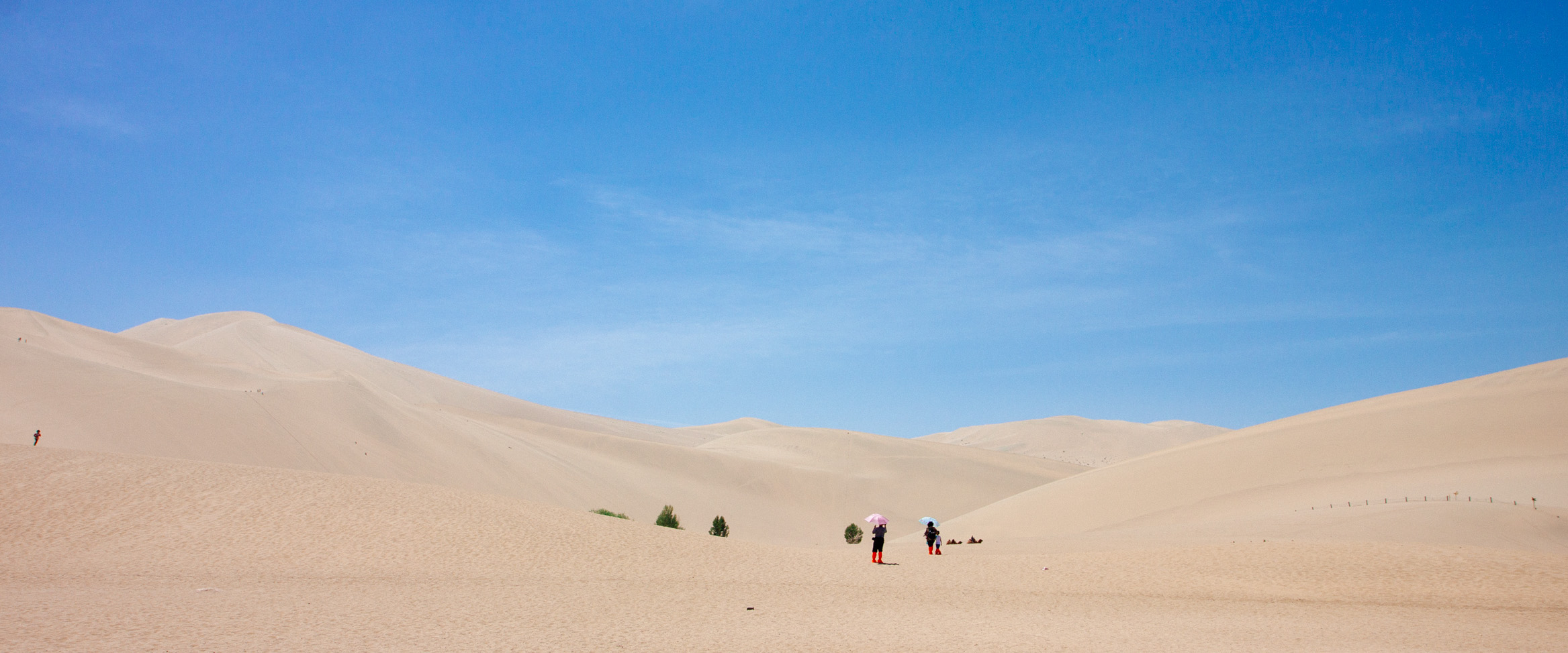 Chinese Tourists and a Barren Desert Scape